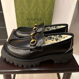 Gucci Black Loafers with Gold Hardware